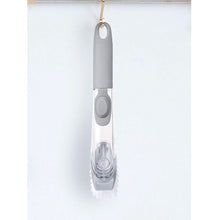 Liquid dispensing dish brush